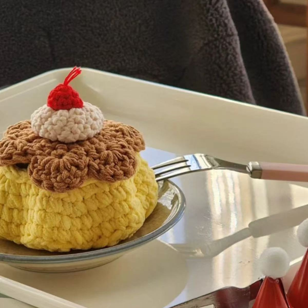 A close-up view of the DIY Crochet Projects Pudding Storage Box Kit, showing the colorful yarn