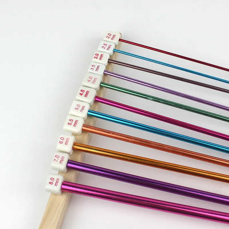 Color-coded Tunisian crochet hooks set for easy size identification.